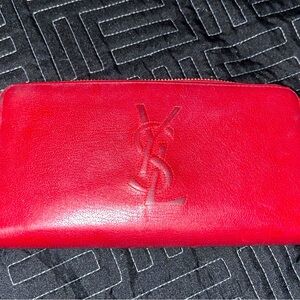 Red leather ysl hand bag.Small scuffs but much life Authentic with tags